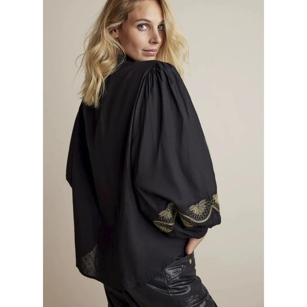 Black cotton blouse with gold thread detailing on the chest and around the sleeve