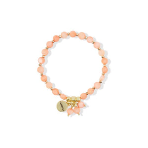 peach coloured circular beads with cluster bead charm