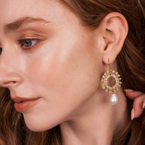 individually hand looped tiny gemstone beads in an intricate floral pattern, adorned with a faceted set teardrop gemstone. These elegant showstopper earrings are made with gorgeous 22 carat gold plating inspired by nature.