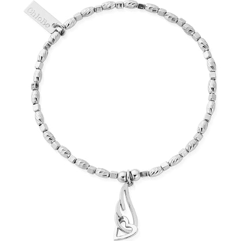 angel wing charm, interlocked with an open-heart charm