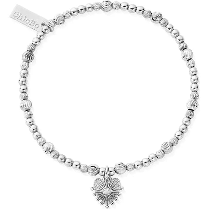silver bracelet with beaming heart