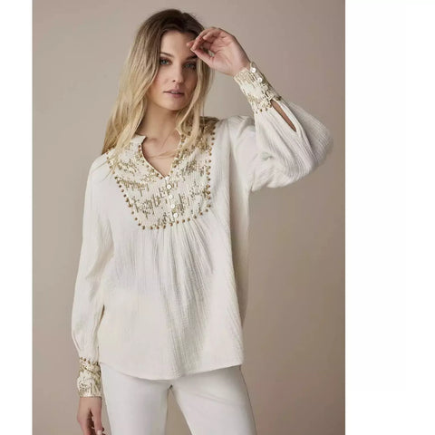 cream cotton blouse with gold sequin in chest and cuffs with snmall white buttons 