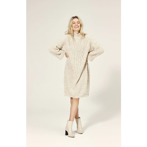 knitted dress is made from a soft acrylic wool blend and features a stand-up rib-knit polo neck that keeps you warm even on the coldest days. The slightly fitted shape creates a beautiful, feminine silhouette, while the folded cuffs and high side slits add a playful touch. 