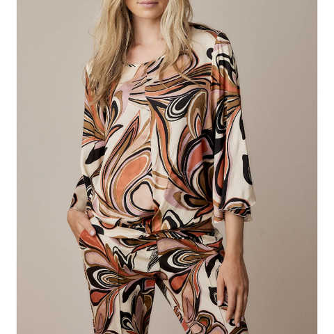 neutral toned pinks in a swirl pattern, long sleeves and sligt twist at hem 